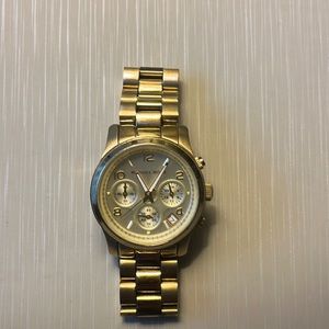 Michael Kors gold watch.
